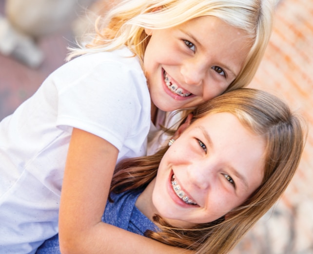 Girls with braces at Brooks Orthodontic Studio in Alpharetta, GA